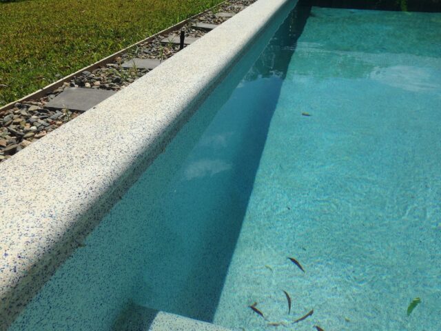 Pool built by Pools by Boris & Larry Batchelor. Pool finishes in Fijian Seas, exposed coping done in Kirra Blue.