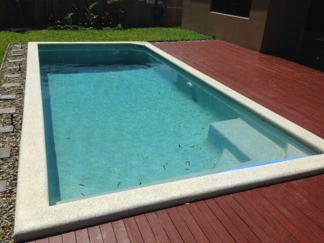 Pool built by Pools by Boris & Larry Batchelor. Pool finishes in Fijian Seas, exposed coping done in Kirra Blue.