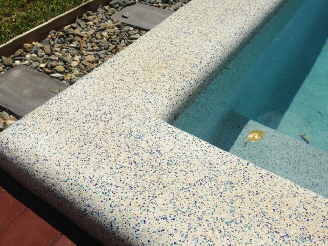 Pool built by Pools by Boris & Larry Batchelor. Pool finishes in Fijian Seas, exposed coping done in Kirra Blue.