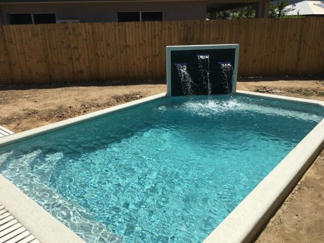 Pool built by Pools by Boris & Larry Batchelor. Pool finishes in Fijian Seas, exposed coping done in Kirra Blue.