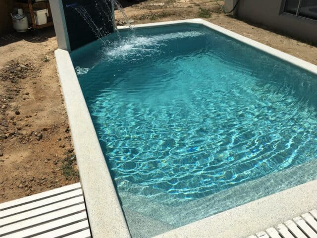 Pool built by Pools by Boris & Larry Batchelor. Pool finishes in Fijian Seas, exposed coping done in Kirra Blue.